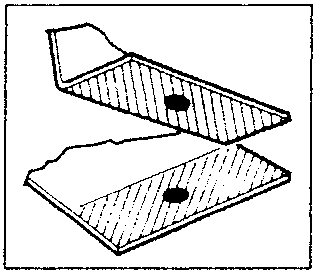 Two metal sheets being joined with weld spots