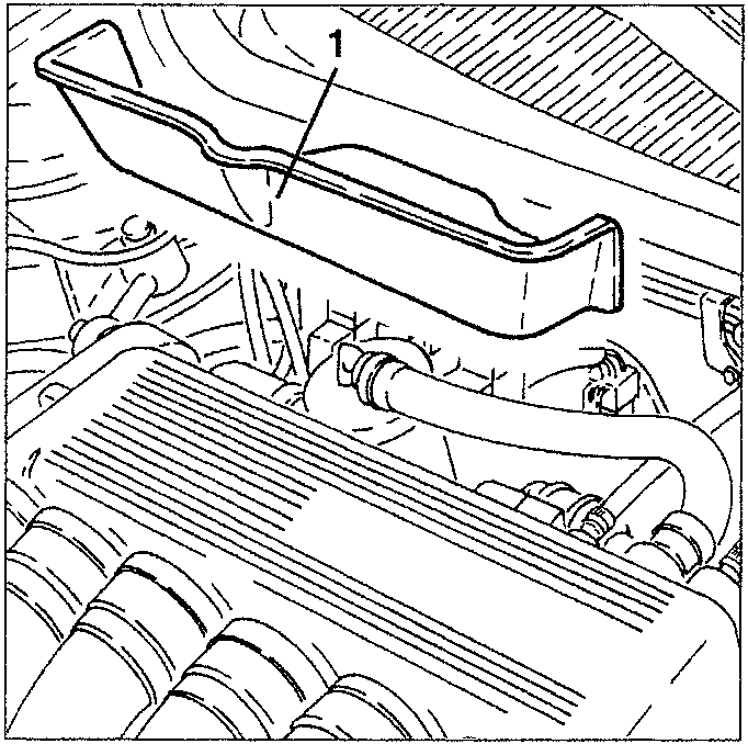 Engine compartment showing heat guard being removed