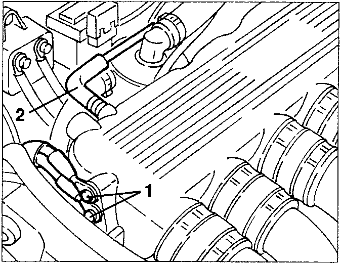 Engine bay showing vacuum takeoff socket and components labeled 1 and 2.