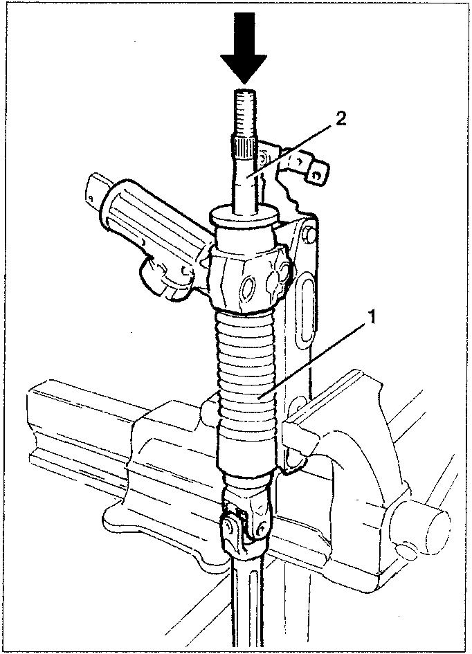 Steering column clamped in a vice with a resin hammer applied