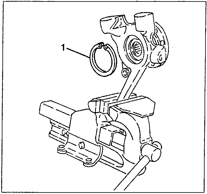 Upright/wheel hub assembly clamped in a vice with flexible hub retainer ring removed