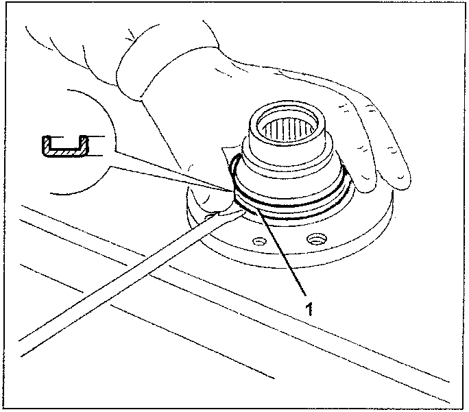 Hand using chisel to remove part from wheel hub