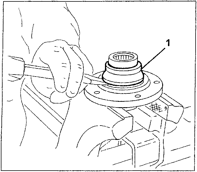 Hand using a chisel to move the bearing inner race away from the wheel hub. Part 1 is labeled on the bearing inner race.