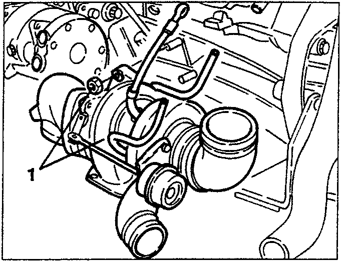 Turbocharger mounted on engine with hoses connected