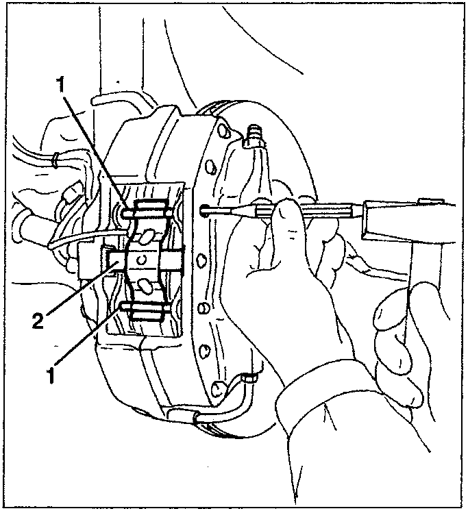 Diagram showing hands using a tool to remove brake pad fastening pins and cross spring from a caliper assembly.