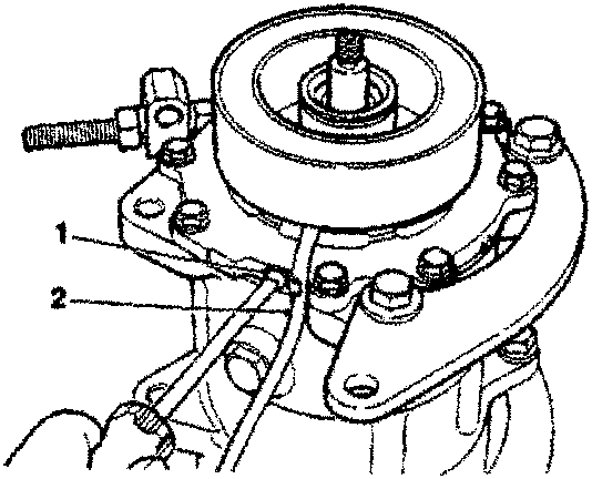 Field coil wire clamp screw and retaining snap ring