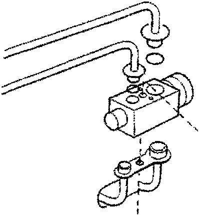 Diagram showing a hand holding a valve plate with gaskets, labeled 1, 2, and 3.