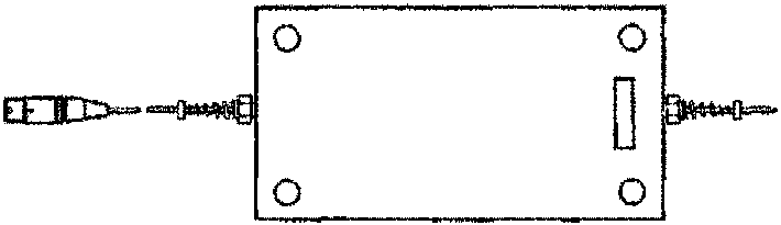 Rectangular box labeled 3130-1242-00 Aston Martin Protocol Adaptor with two connectors