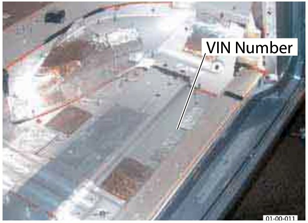 Photo showing the VIN Number stamped on the floorpan in the RH front footwell