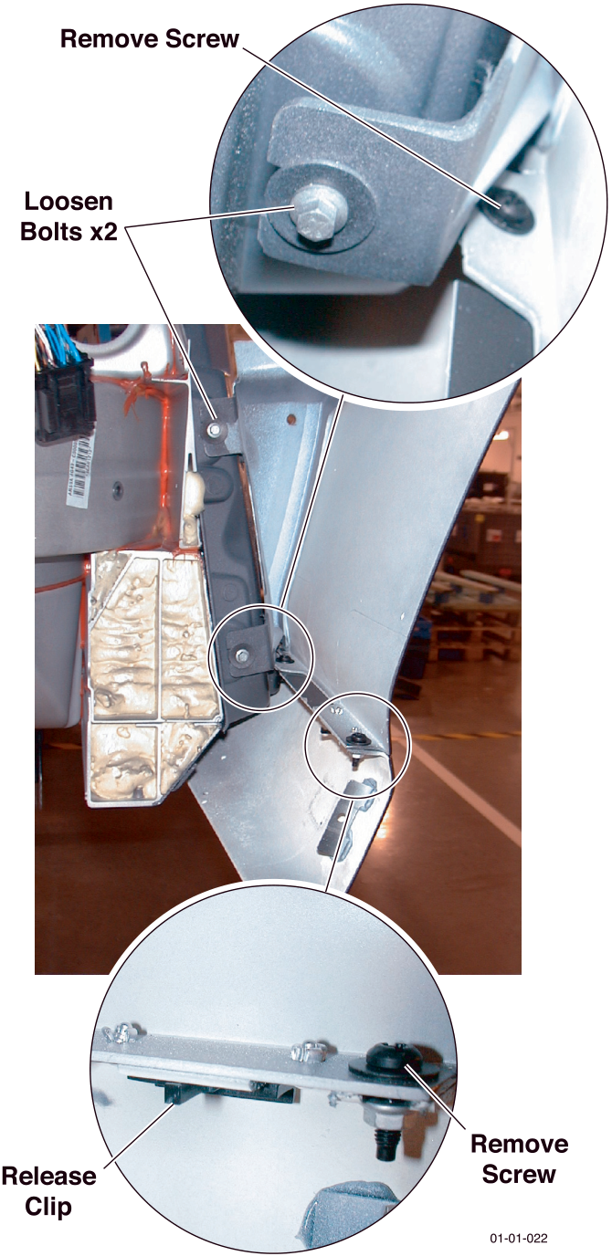 Photo showing wing attachment points with callouts: Remove Screw, Loosen Bolts x2, Release Clip, and Remove Screw