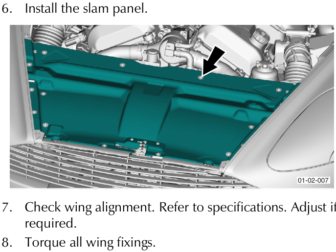 View of the slam panel being installed in the front engine bay area