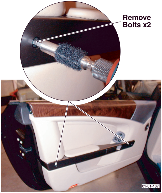 Close-up of a screwdriver removing two bolts from the interior door handle assembly, with an inset showing the bolt locations on the wood trim panel.