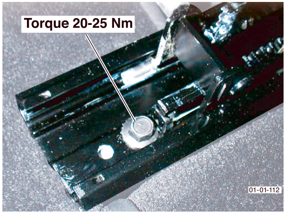 Photo of a bolt being torqued on a seat rail with label 'Torque 20-25 Nm'