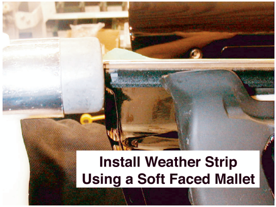 Image showing a soft faced mallet being used to install the weather strip