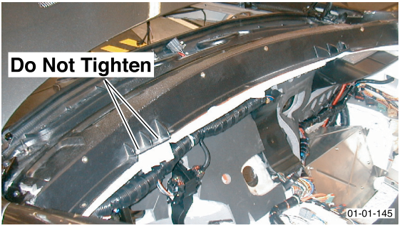 Photo showing the upper dashboard area with a label 'Do Not Tighten' pointing to bolts.