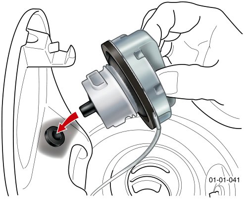 A diagram showing a hand unscrewing the fuel filler cap from the fuel filler neck inside the wheel arch. An arrow indicates the direction of removal.