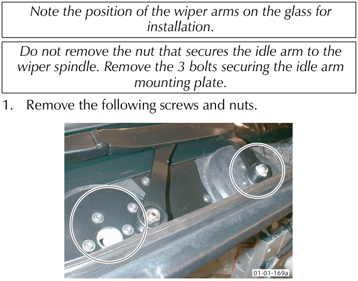 Image showing the idle arm mounting plate with two circled areas indicating locations of screws and nuts.