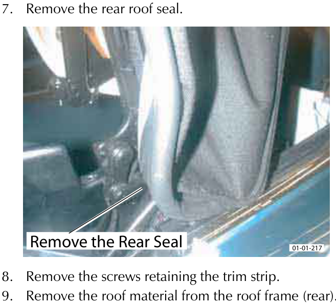 A hand removing the rear roof seal from the vehicle frame.