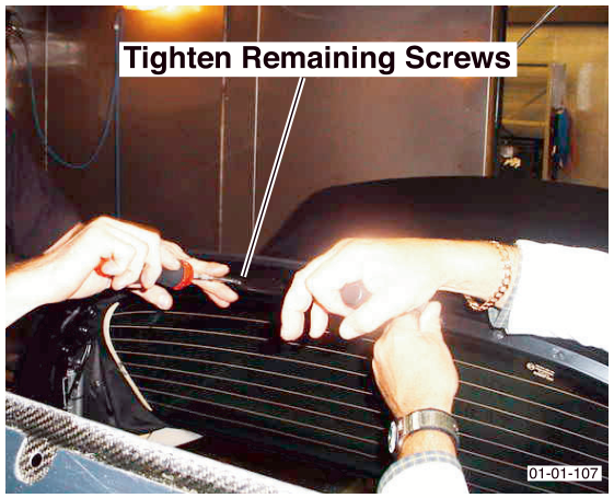 Technician tightening remaining screws on the convertible roof with text overlay 'Tighten Remaining Screws'