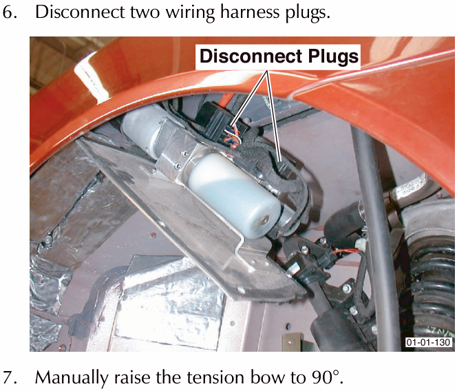 View of the rear compartment showing two wiring harness plugs being disconnected, labelled Disconnect Plugs.