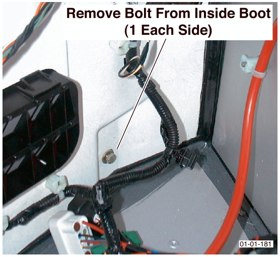Interior boot area showing a bolt to be removed, labeled Remove Bolt From Inside Boot (1 Each Side)