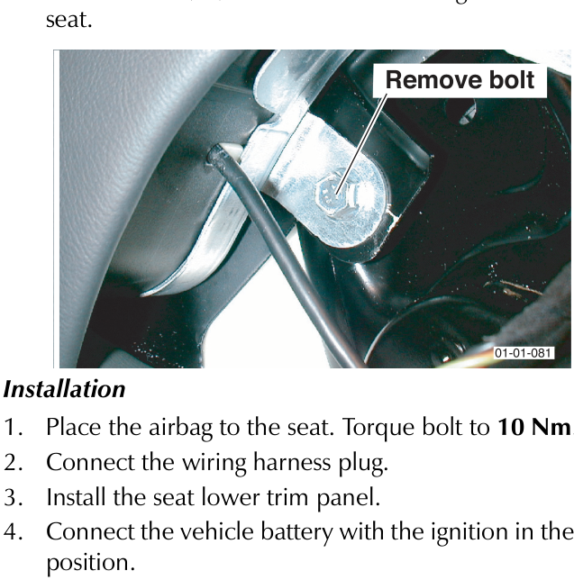 Close-up view of a bolt securing the airbag module to the seat structure, with an arrow pointing to the bolt.