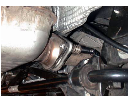 Photo showing the underside of the vehicle with exhaust silencer and pipes
