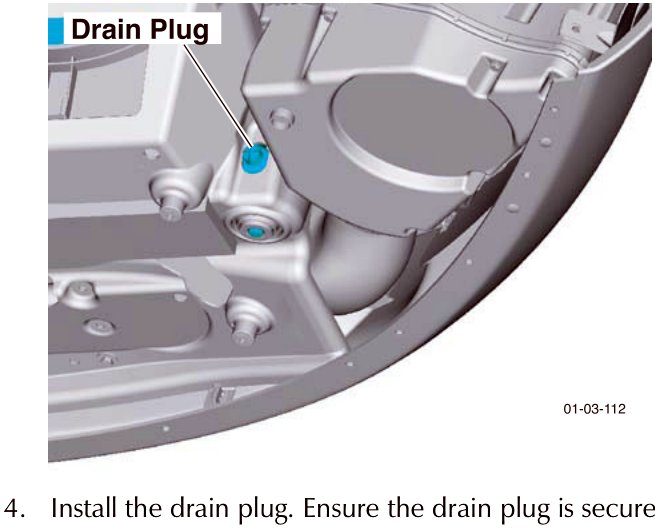 Photograph of the engine bay underside showing the location of the coolant drain plug.