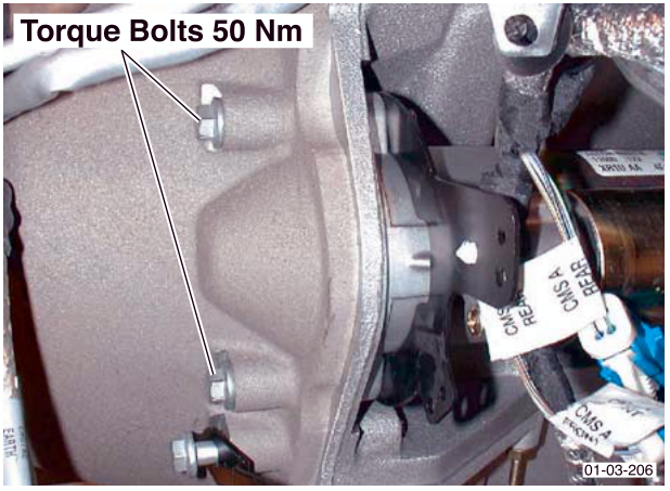 View of starter motor mounting bolts with callout label 'Torque Bolts 50 Nm'
