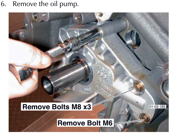 Image showing removal of bolts securing the oil pump