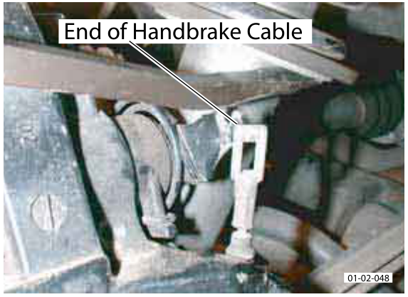 Close-up photo showing handbrake cable end and callout 'Access for Bolts x3 Torque 56-85 Nm'