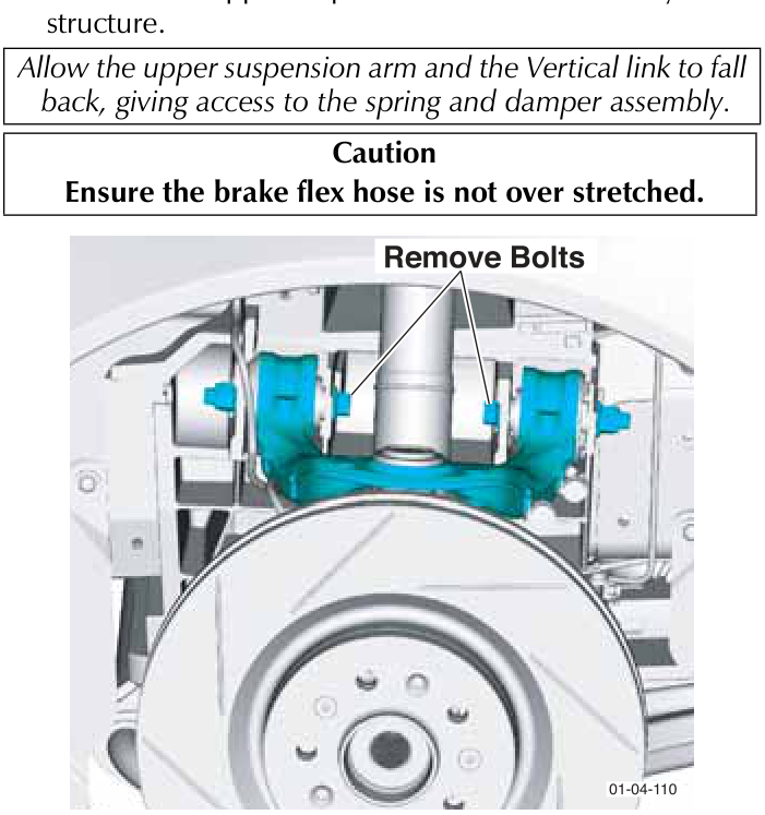 View of the upper suspension arm bolts being removed near the brake disc and caliper assembly