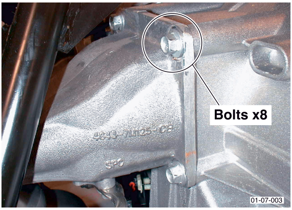 Photo of the transaxle mounting bracket showing eight bolts labeled 'Bolts x8'.