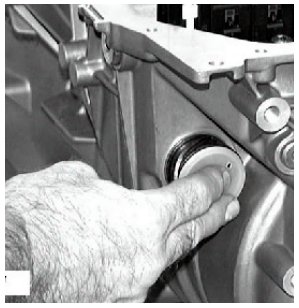 A hand pressing an electric socket into the Mechatronik unit