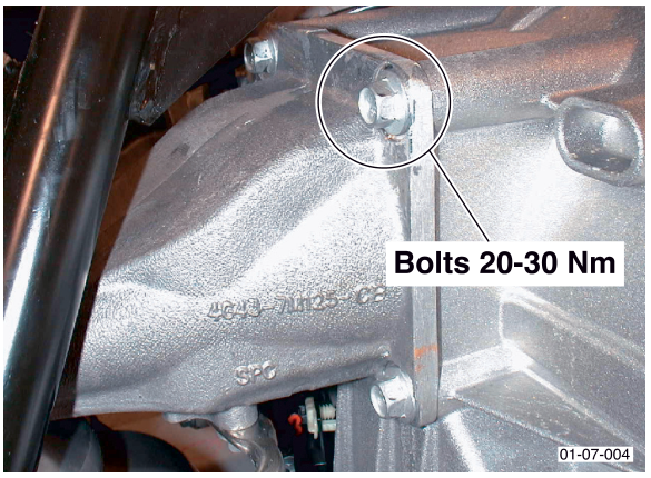 Close-up photograph of transaxle mounting bracket bolts with callout text 'Bolts 20-30 Nm'