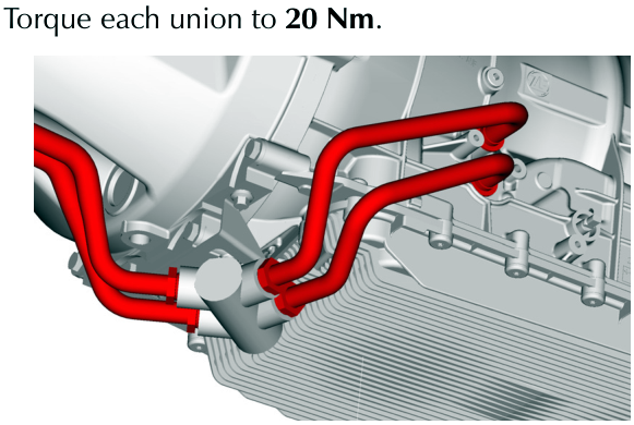 View of red coolant pipes connected to the gearbox with union joints highlighted in red