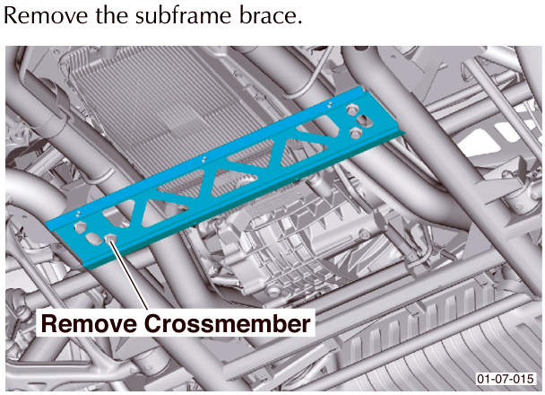 View of the subframe crossmember being removed from under the vehicle chassis