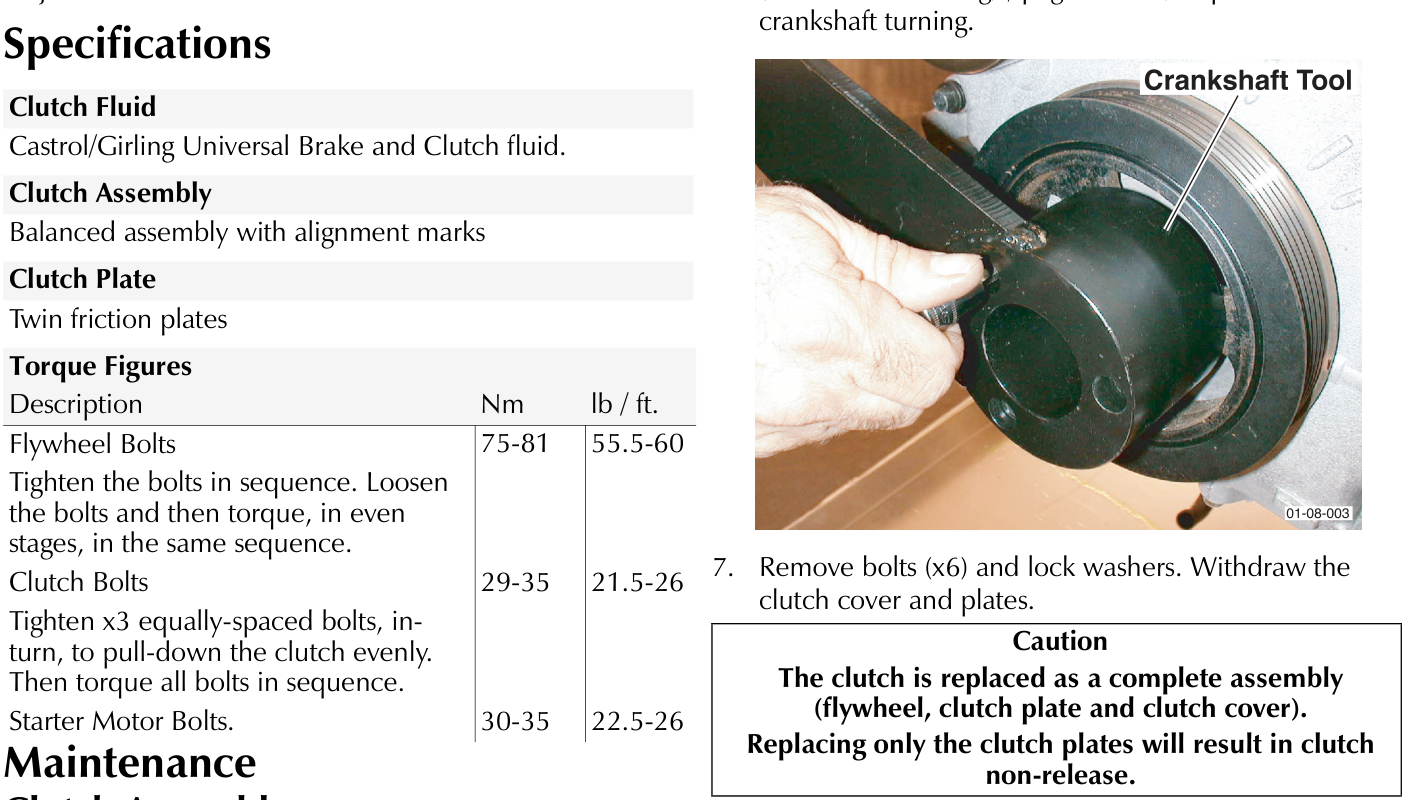 A hand positioning a black Crankshaft Tool against the engine's flywheel pulley area.