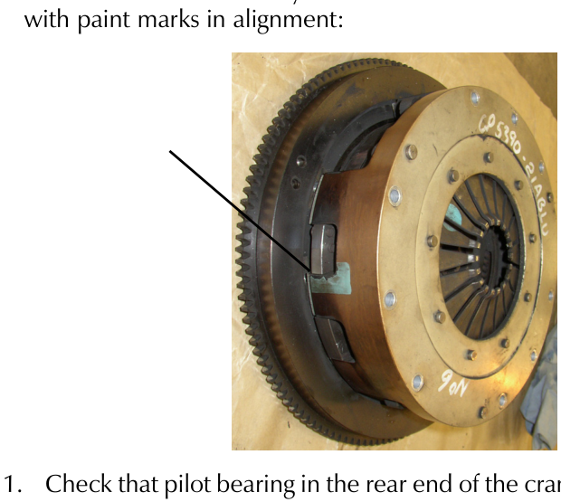 Clutch assembly aligned with paint marks on flywheel