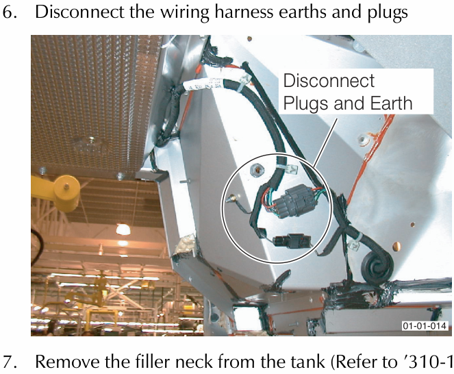View from underneath showing wiring harness connectors and earth strap with callout text 'Disconnect Plugs and Earth'