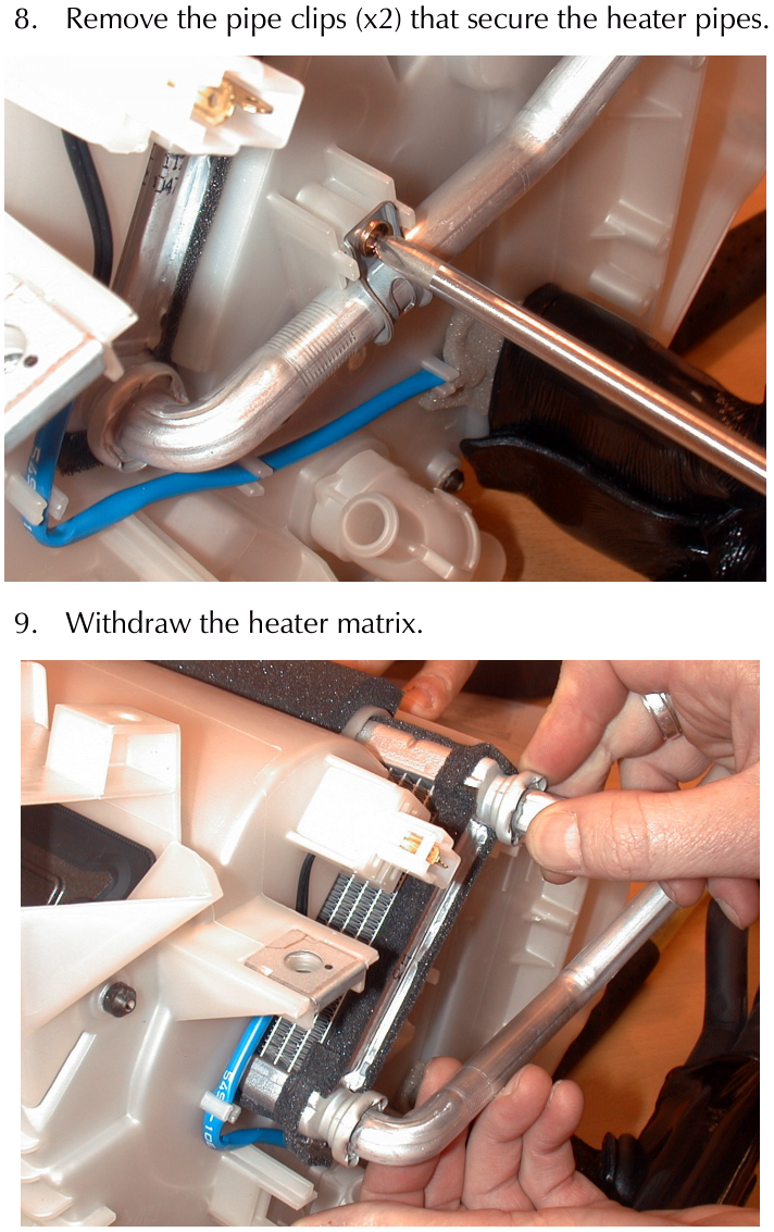Screwdriver removing a clip securing silver heater pipes inside the vehicle dashboard assembly.