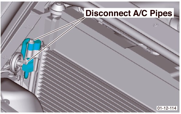 Close-up view of A/C pipes being disconnected from the condenser