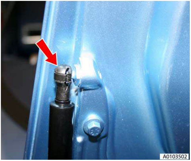 Close-up of a gas strut clip being released on the left-hand side.