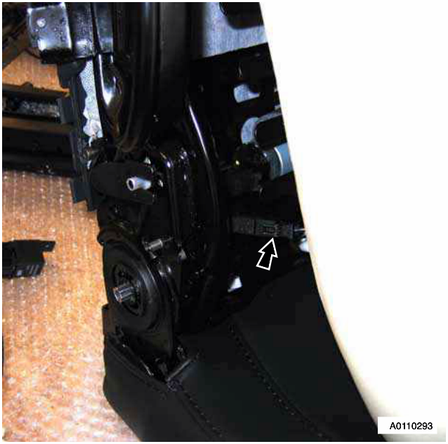 Close-up of the heater multiplug being disconnected