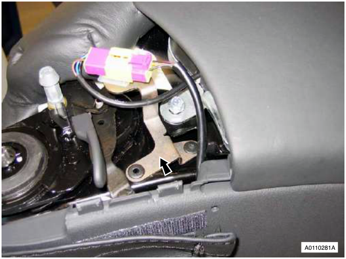 Airbag module with bolt and lever cover being removed