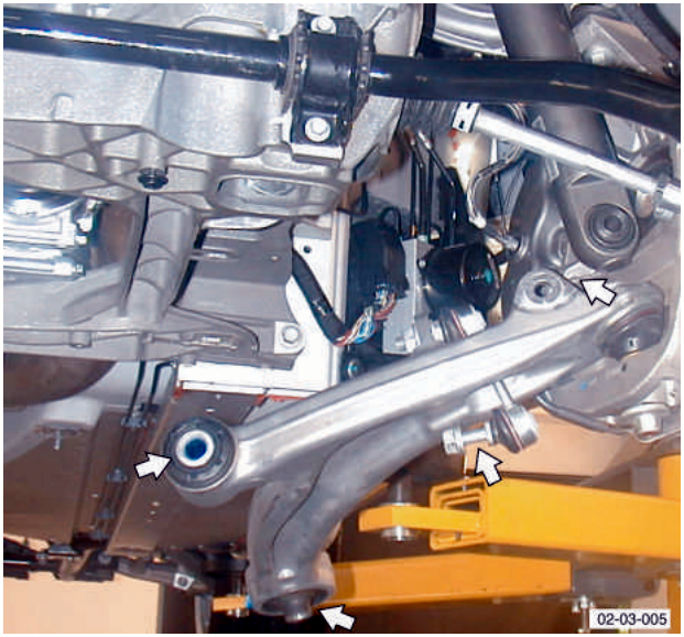 Shows engine mount and suspension components with arrows indicating points of interest