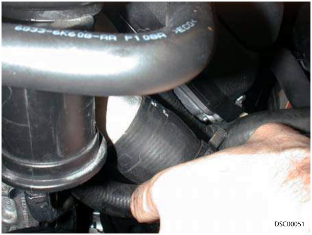 Bottom hose being disconnected and tied aside