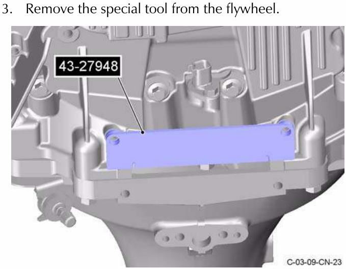 Engine with special tool removed from flywheel, showing part number 43-27948.