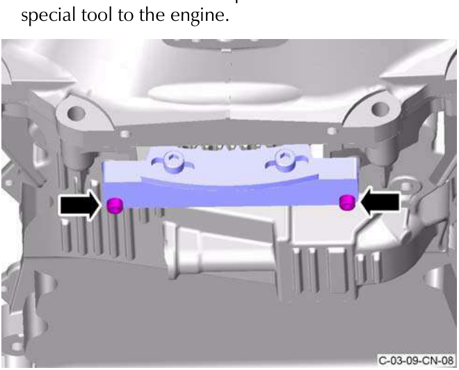 Engine showing socket cap screws attaching special tool