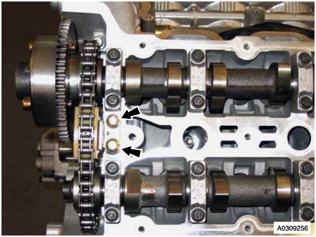 Secondary timing chain tensioner bolts on cylinder head